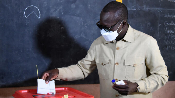 Incumbent Patrice Talon casts his ballot during Benin's presidential election in Cotonou on April 11, 2021.
